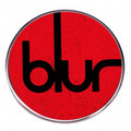 Blur, A British Rock Band, Has A Golden Badge As An Accessory