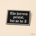 "The Horrors Persist, But So Do I" Patch Pin